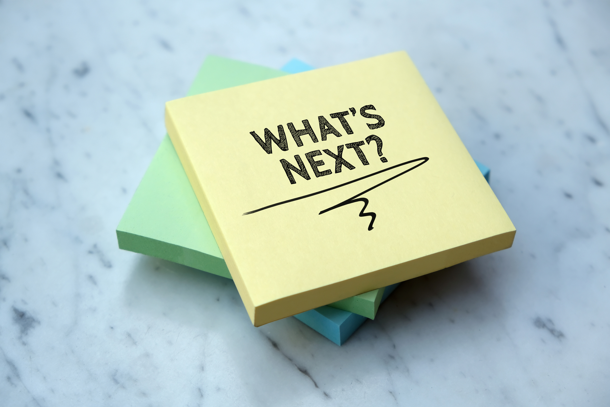 Post-it note saying "What's Next?"