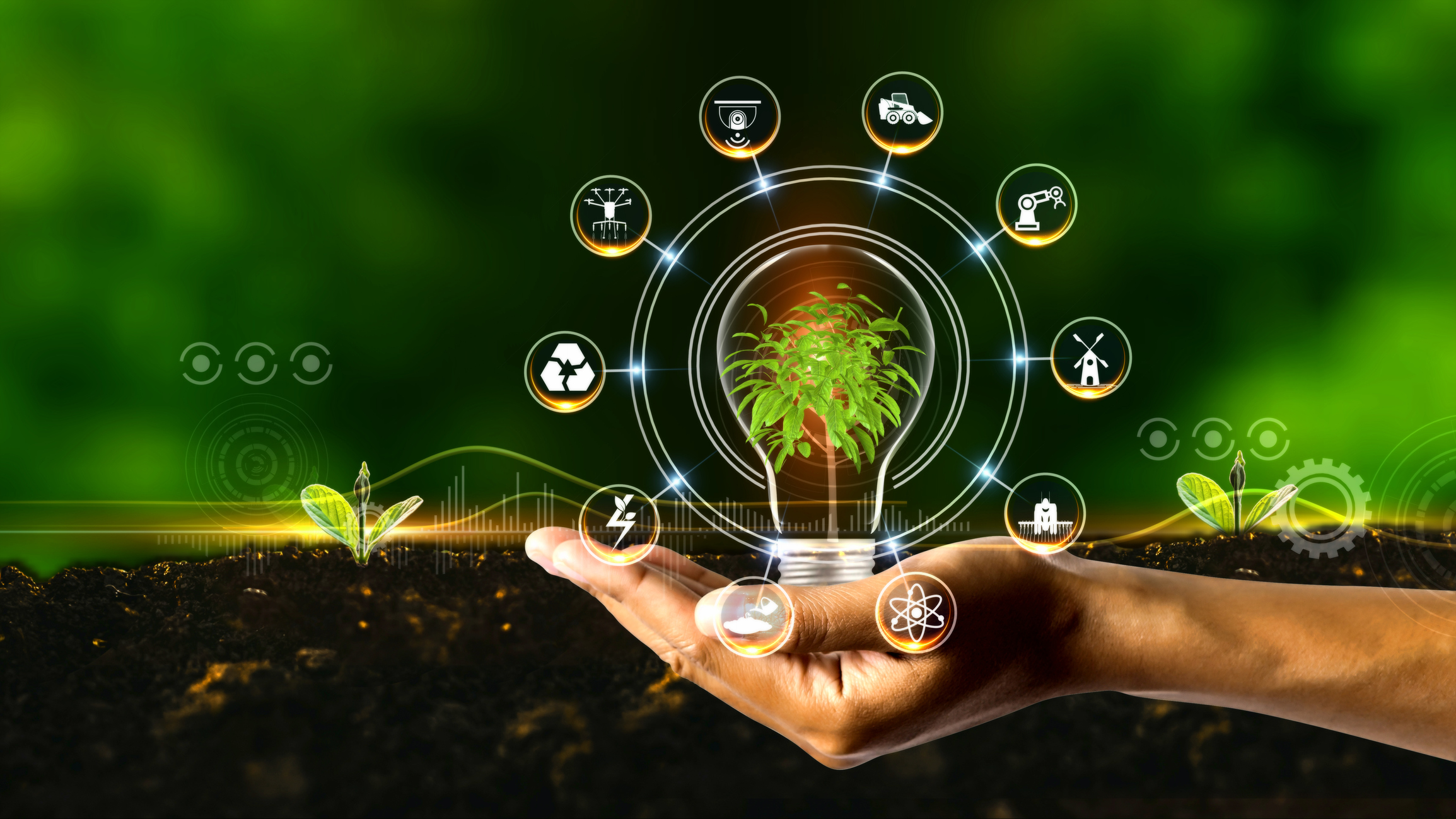 A green image representing smart farming using a hand, farm innovations and a light bulb