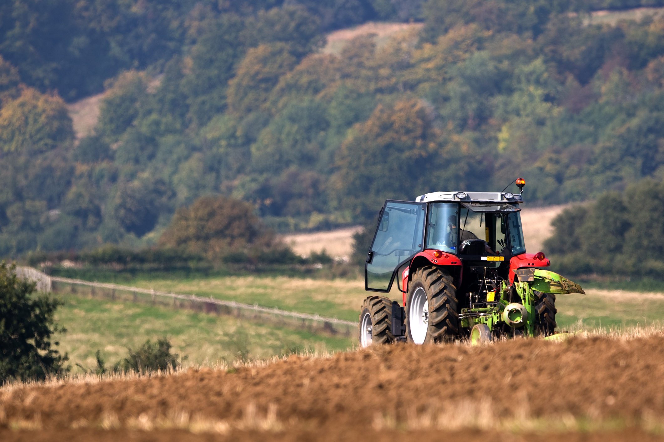 Man on a tractor in field