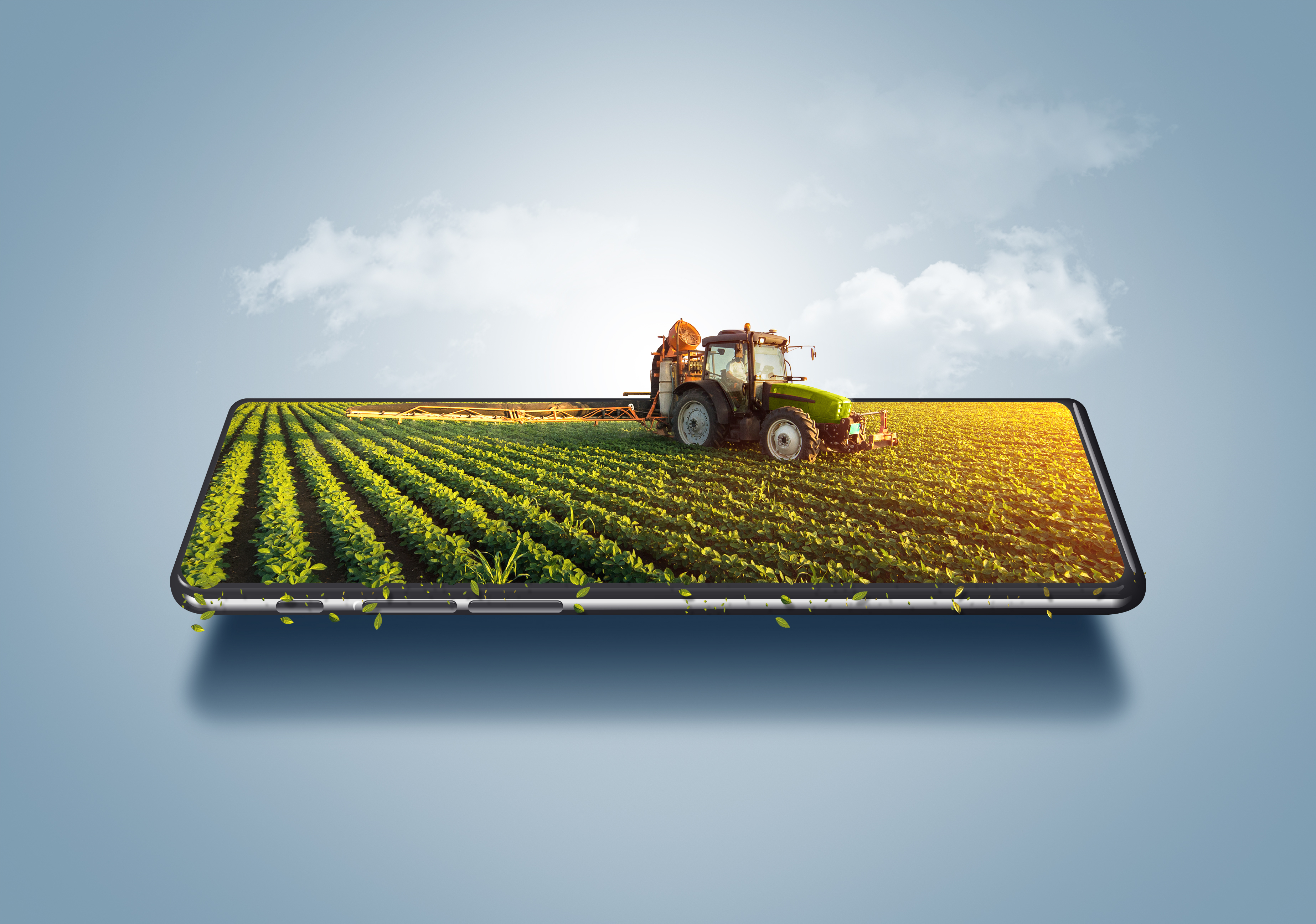Tractor on a smartphone showing smart farming and agricultural technology