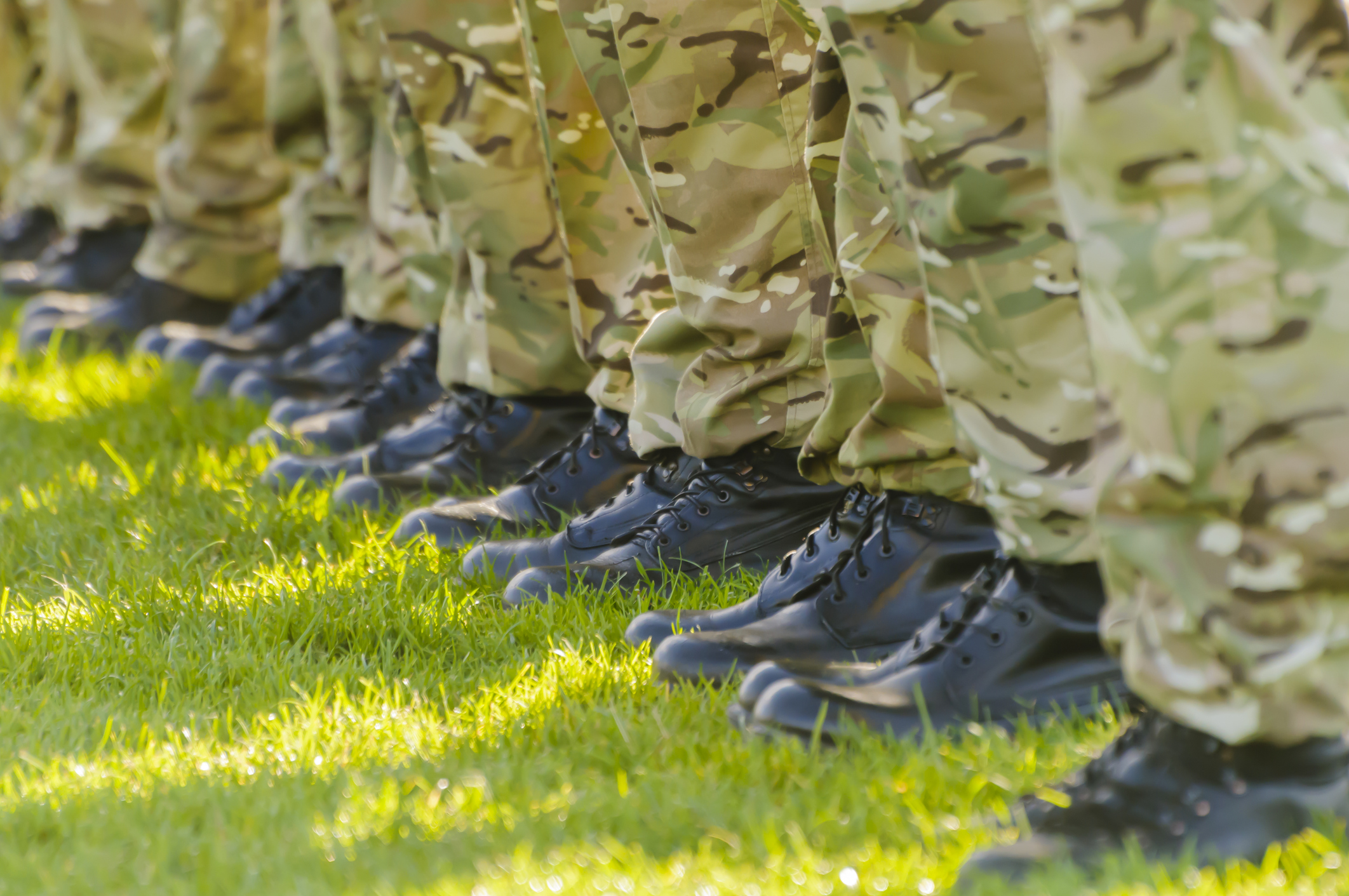 Army military soldiers on parade in a field