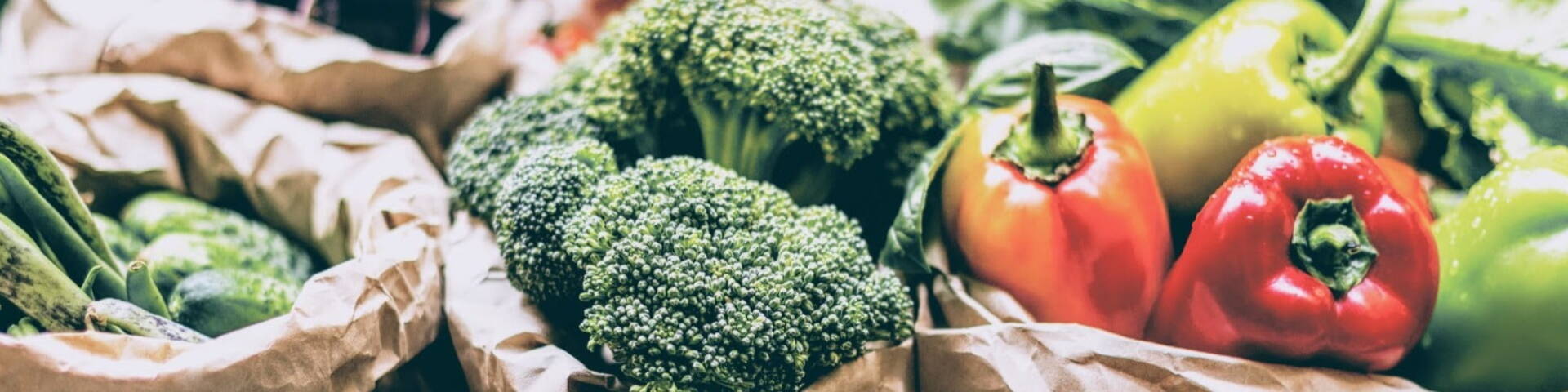 fresh vegetables in brown paper bags
